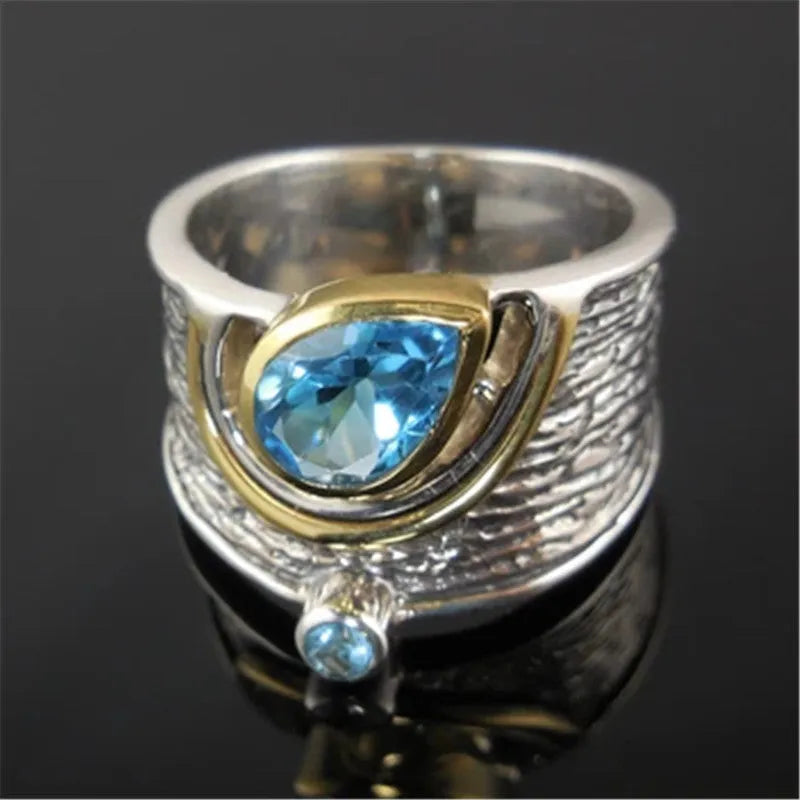 Blue zircon ring with drop shape design and Chinese style influences