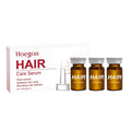 Three small 5ml bottles of nourishing hair root liquid treatment with ginger and rosemary oil.