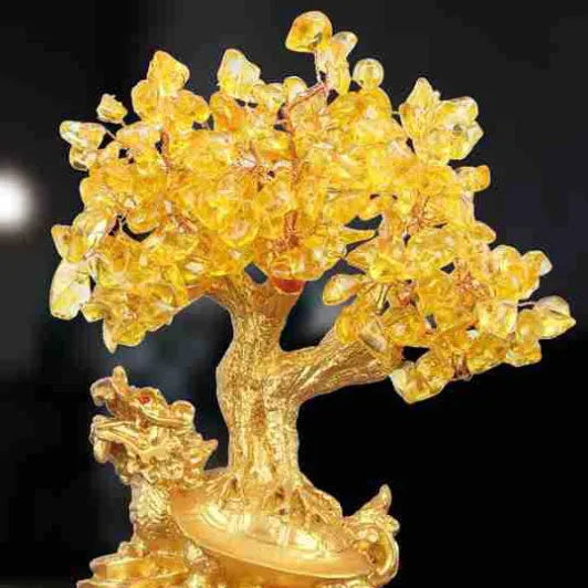 Citrine-coloured resin money tree ornament with a small turtle, measuring 18 by 23 cm.