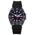 Men's silver waterproof quartz watch with luminous blue dial and steel bracelet on wrist