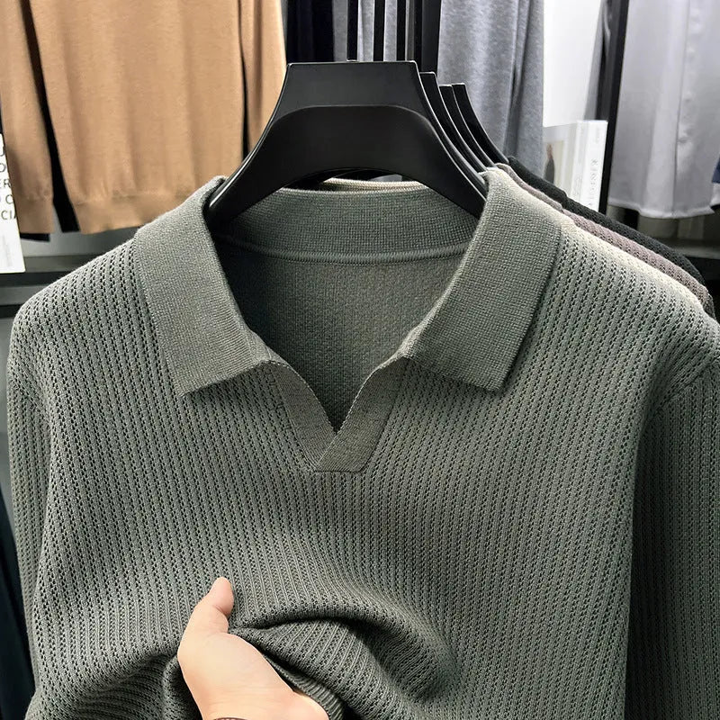 Men's loose-fitting casual pullover sweater in autumn colours on a hanger