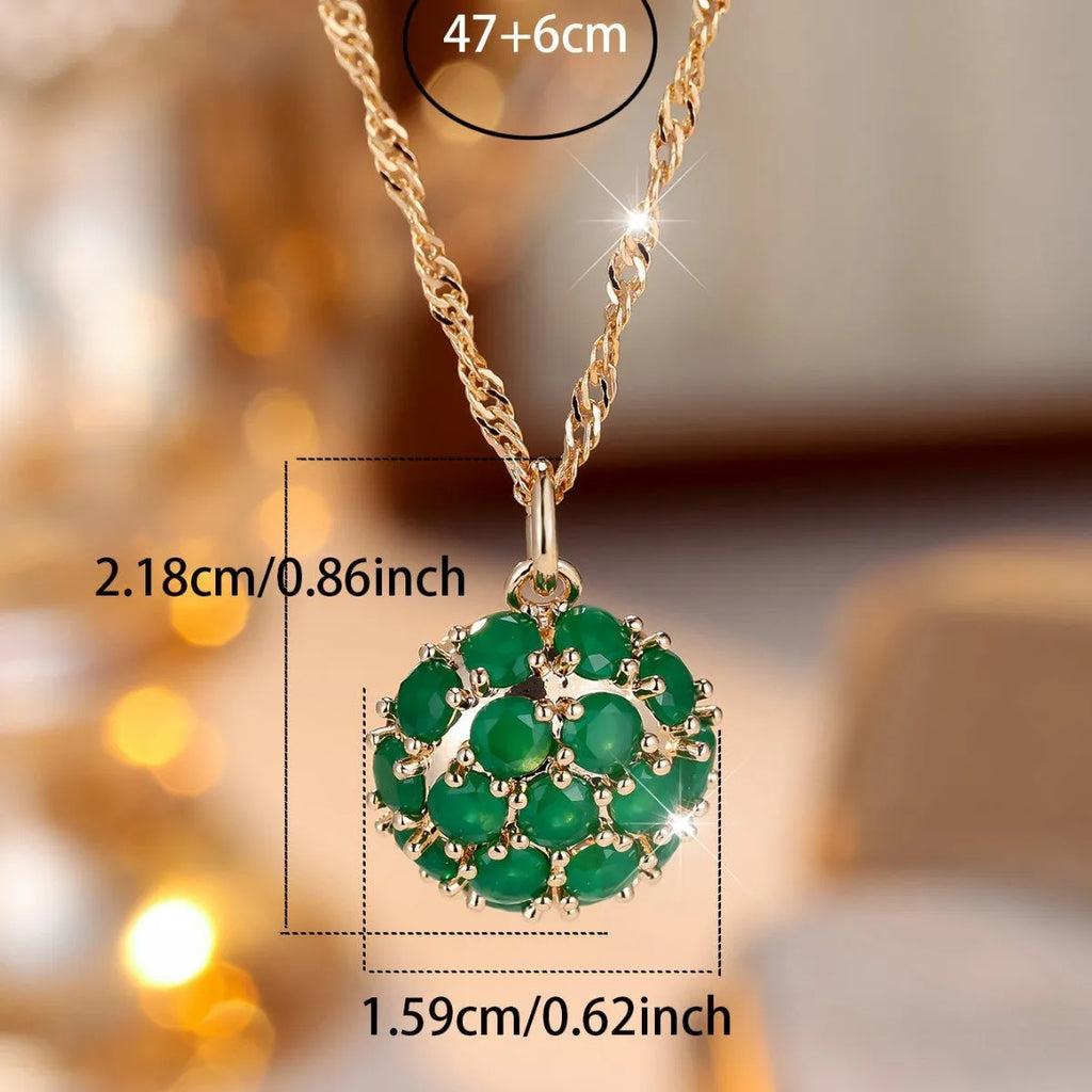 Round emerald and diamond necklace with adjustable chain in champagne gold