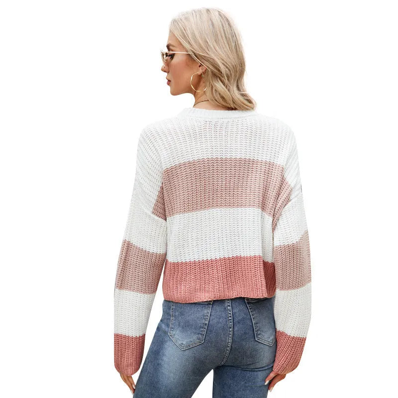 Women's short loose striped pullover sweater in acrylic fabric on a hanger