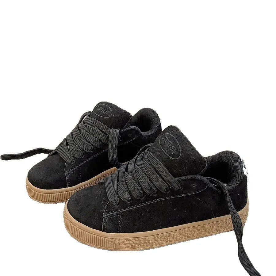 Black retro sneakers with round toe, lace-up front, and waterproof platform on rubber sole
