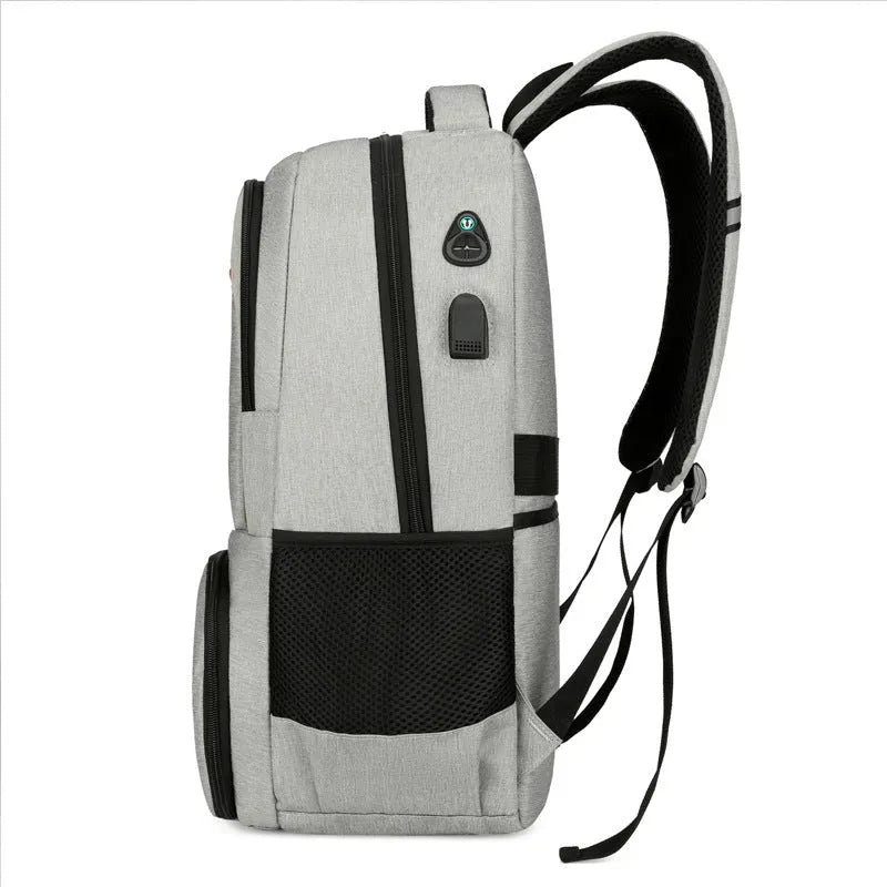 Light grey insulated oxford cloth backpack with curved shoulder straps showing dry-wet separation compartments