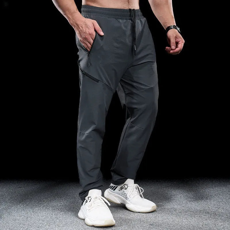 Men's waterproof quick-drying nylon exercise trousers in Army Green colour with mid waist design