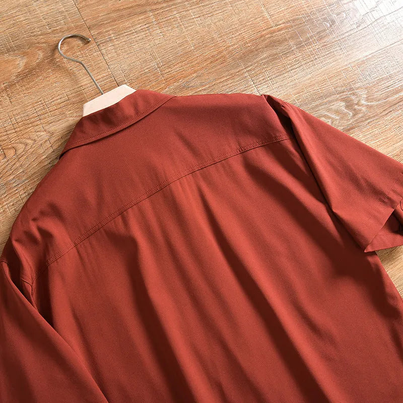 Men's loose fit lightweight short sleeve shirt in a solid colour, showing front design.