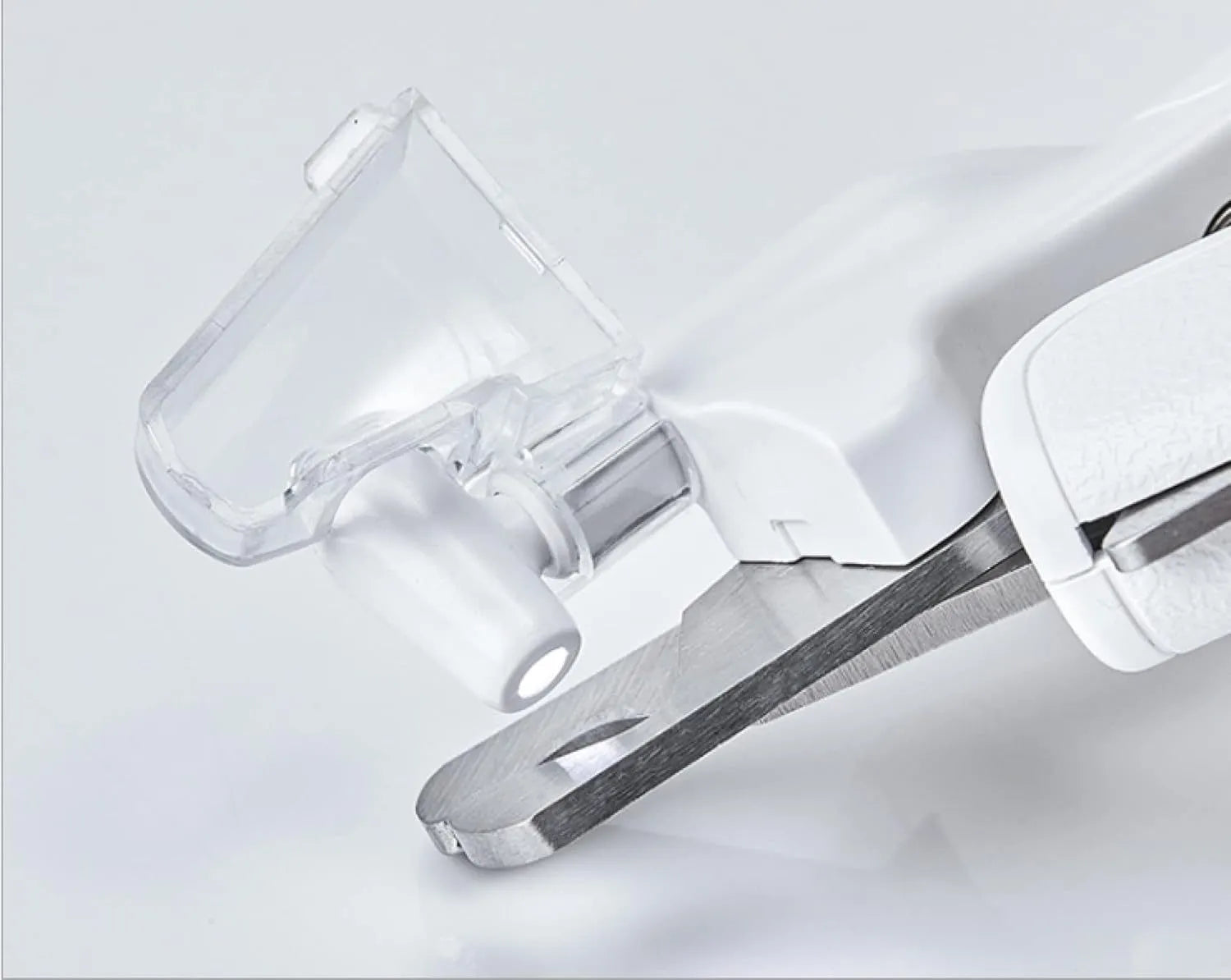 White LED pet nail clipper with transparent anti-splash guard and nail file.