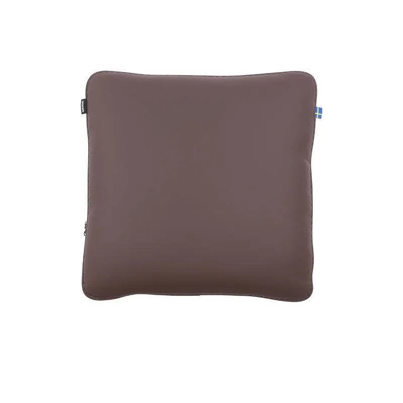 Minimalist brown car headrest with integrated neck pillow and lumbar support cushion.