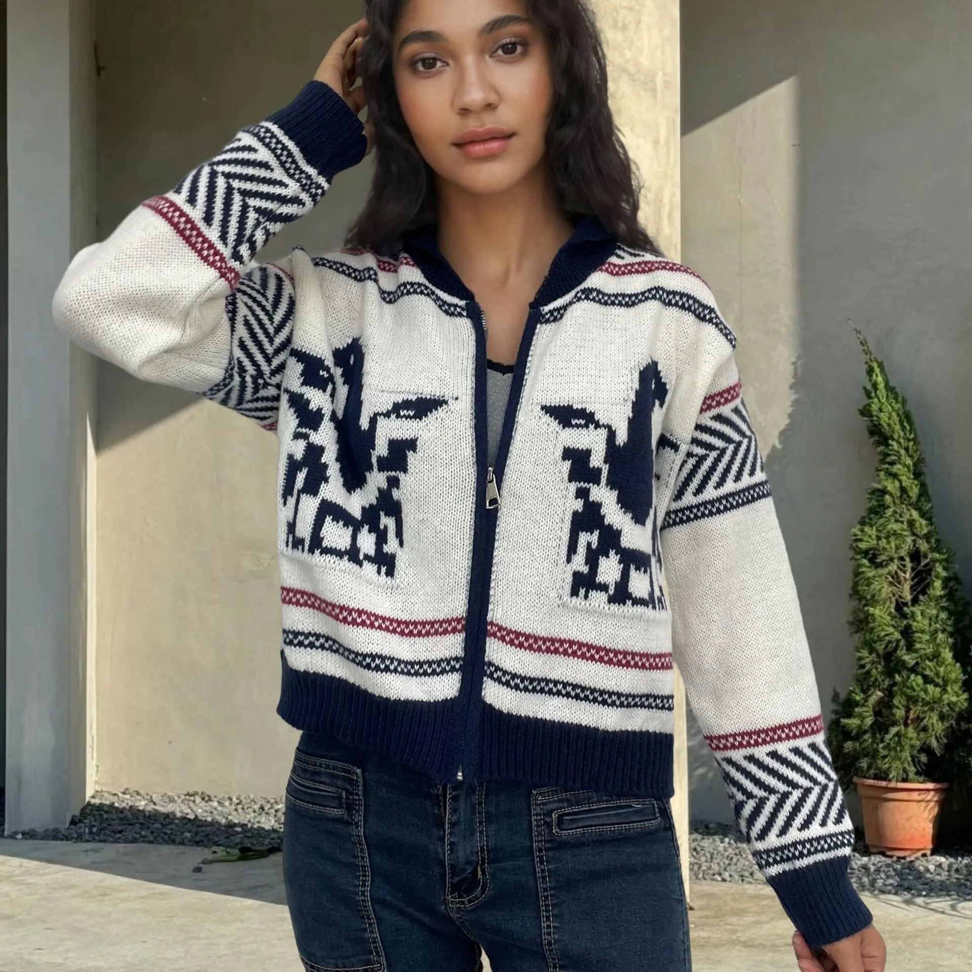 White women's zip-front cardigan sweater with a contrasting jacquard lapel and stripe pattern.