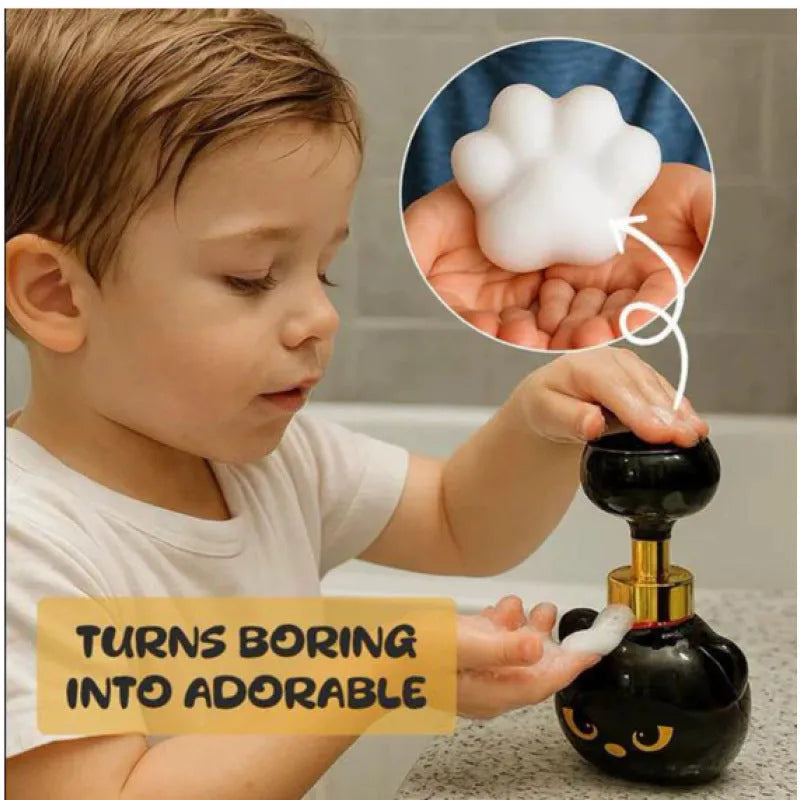 Black cartoon cat-shaped plastic foam soap dispenser on a bathroom counter.