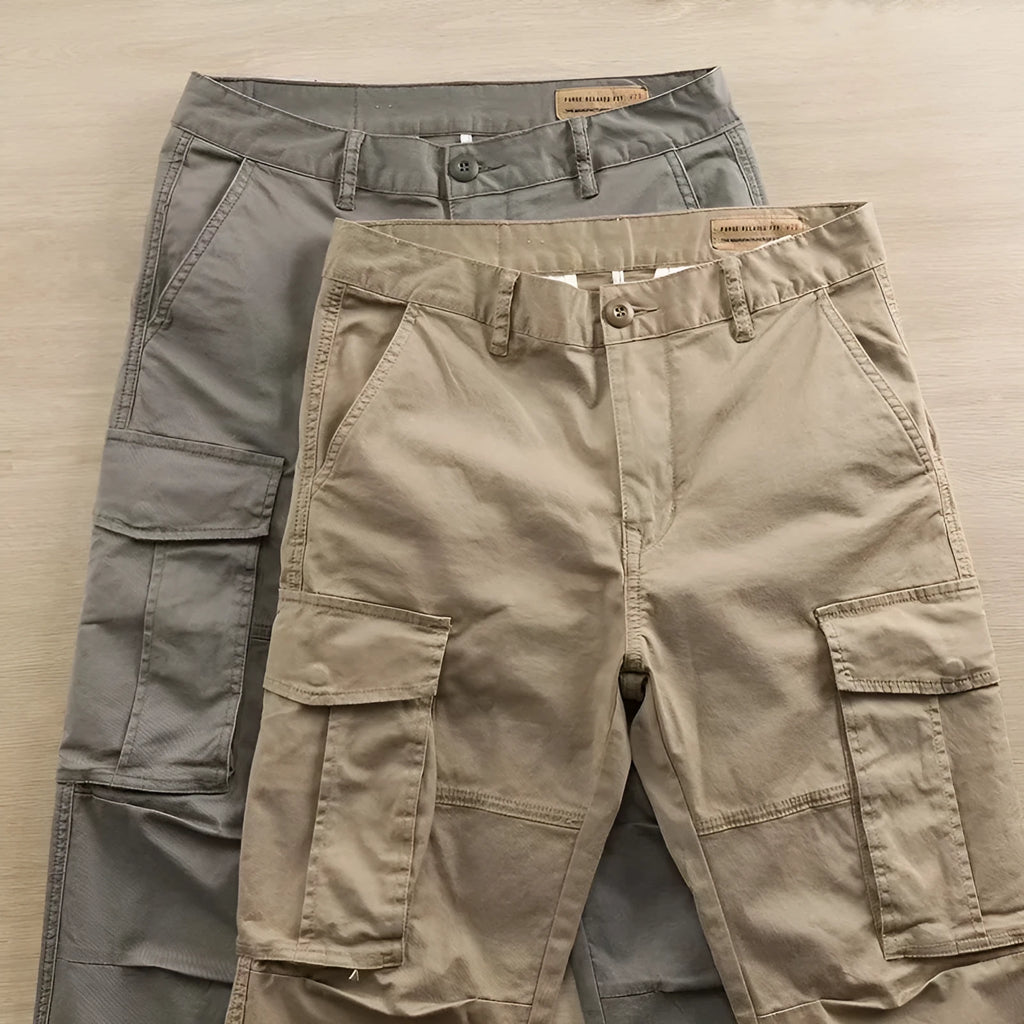 Men's solid colour cotton labour protection trousers in cropped length with multiple pockets, shown in khaki.