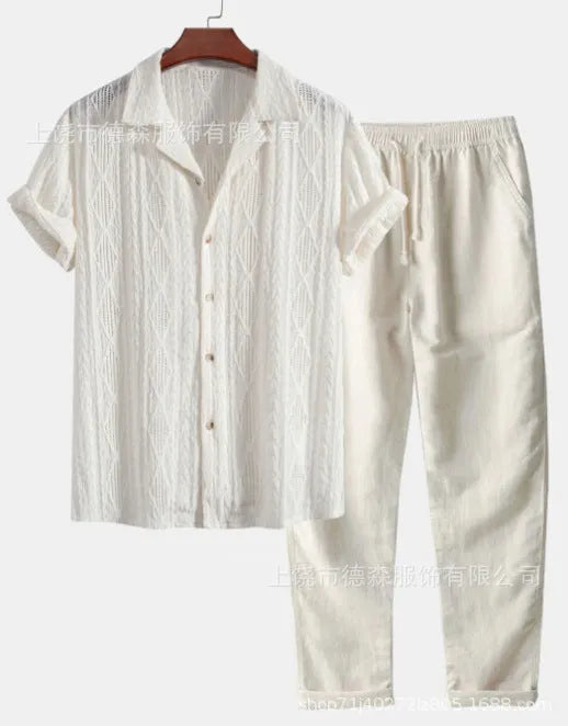 Man wearing a loose light blue short sleeve shirt and matching trousers from a milk silk summer suit.