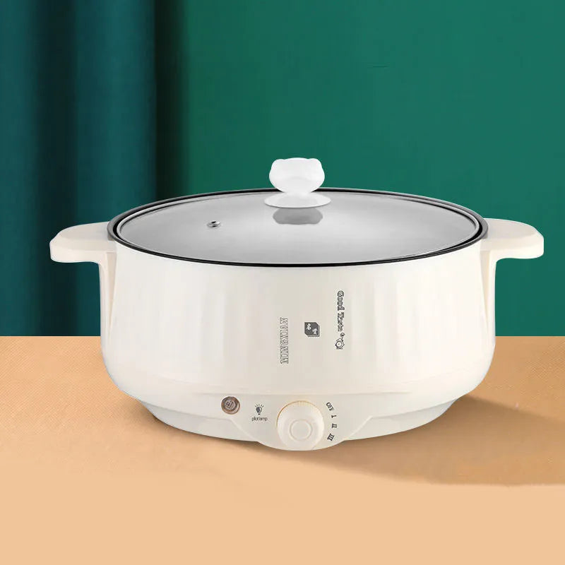 White electric non-stick pot with integrated heating element for steaming and frying