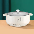 White electric non-stick pot with integrated heating element for steaming and frying