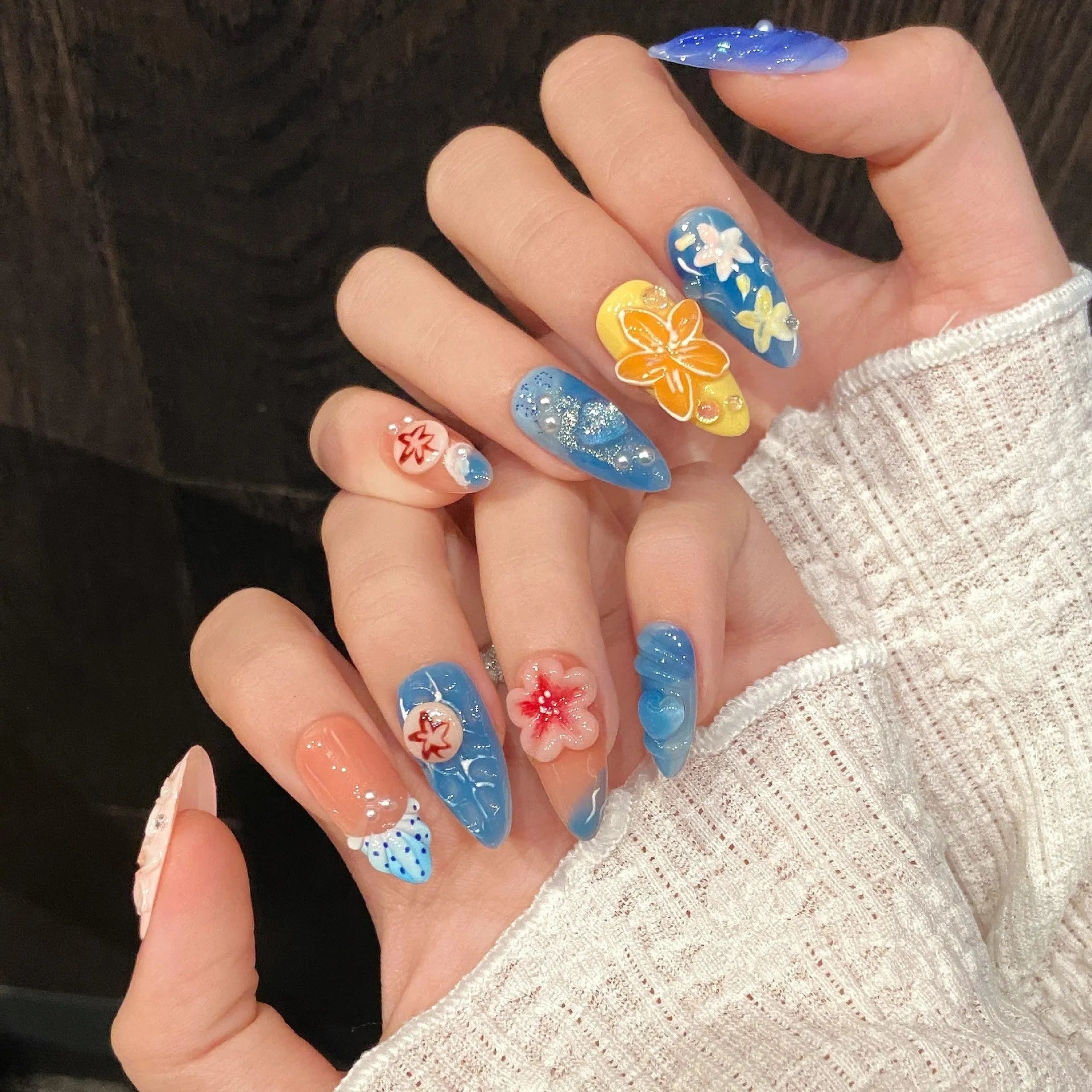 Plastic wearable armour set with three-dimensional carved jellyfish design in almond nail colour