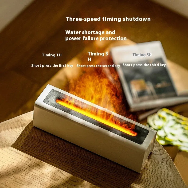 Square black and white USB aroma diffuser humidifier with colourful simulated flame lighting effect.