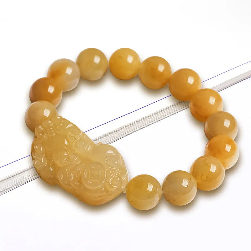 Personalised money symbol bracelet carved from golden thread jade, showing large and small size options.