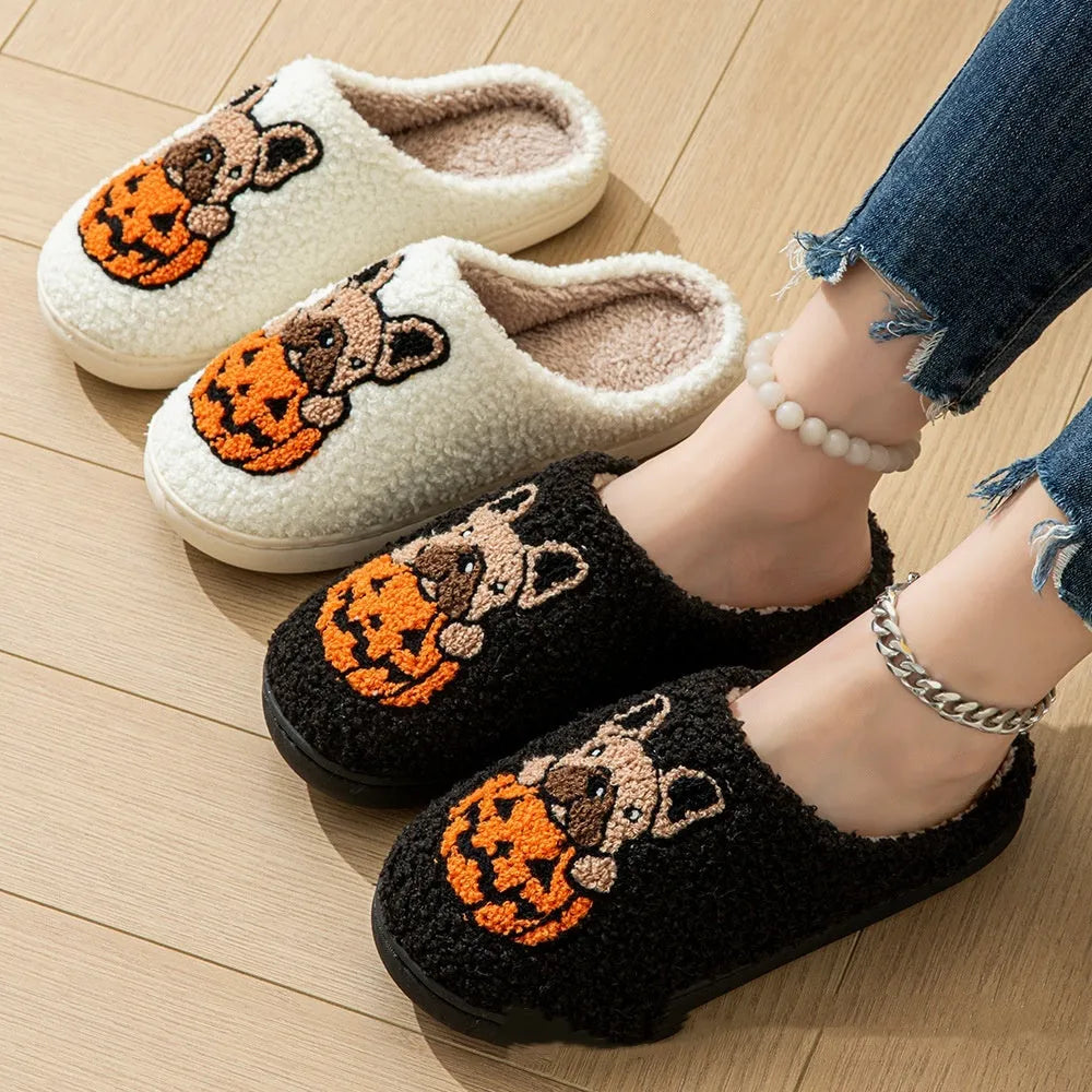 Black and white Halloween pumpkin plush slippers with TPR rubber soles in multiple sizes