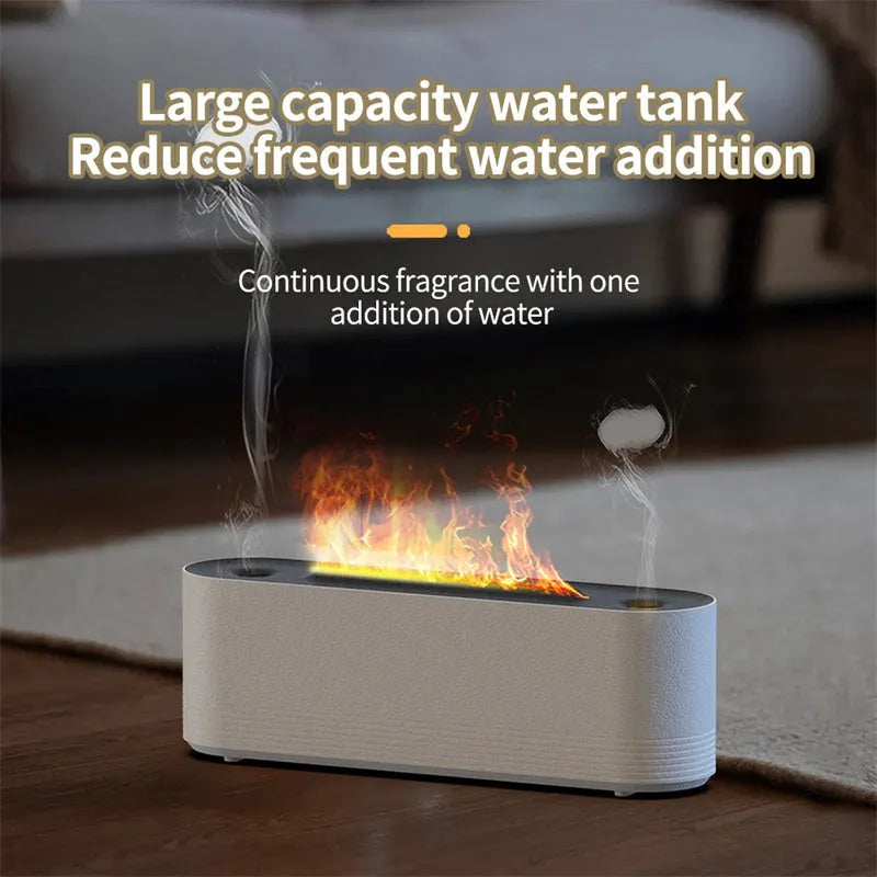 Tall black ultrasonic aroma diffuser with coloured flame LED light and rising water mist on a desk.