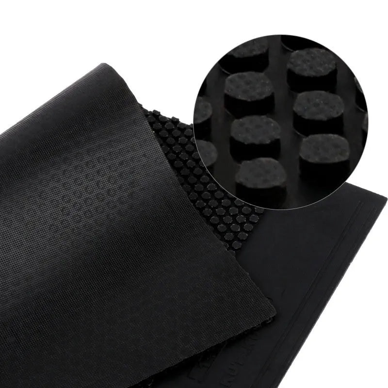 Single sheet of black and red raw rubber for table tennis rackets with small particle texture.