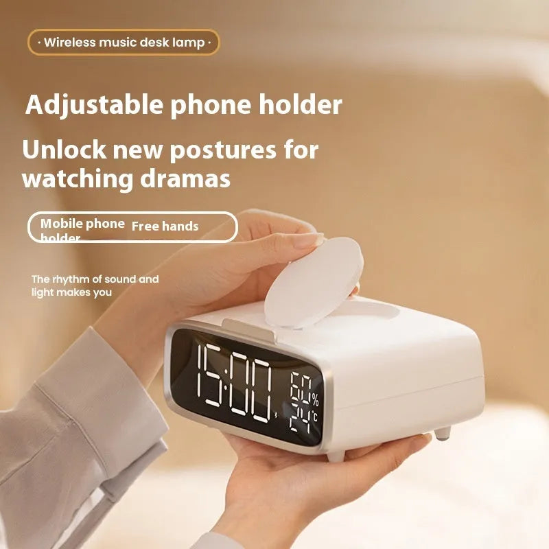 White wireless charging Bluetooth speaker with night light and alarm clock display on desk