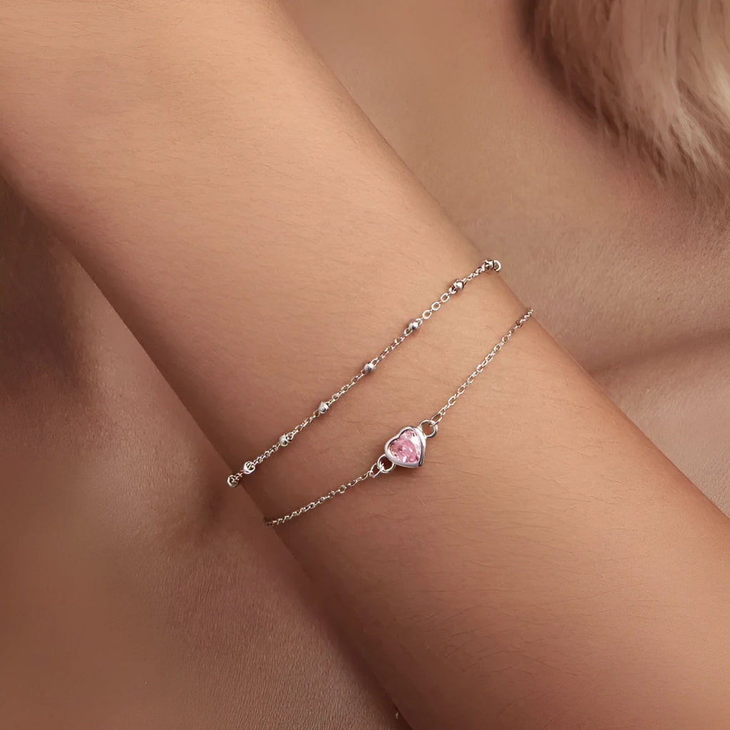 Women's 925 sterling silver bracelet with a small heart-shaped pendant on an adjustable chain.