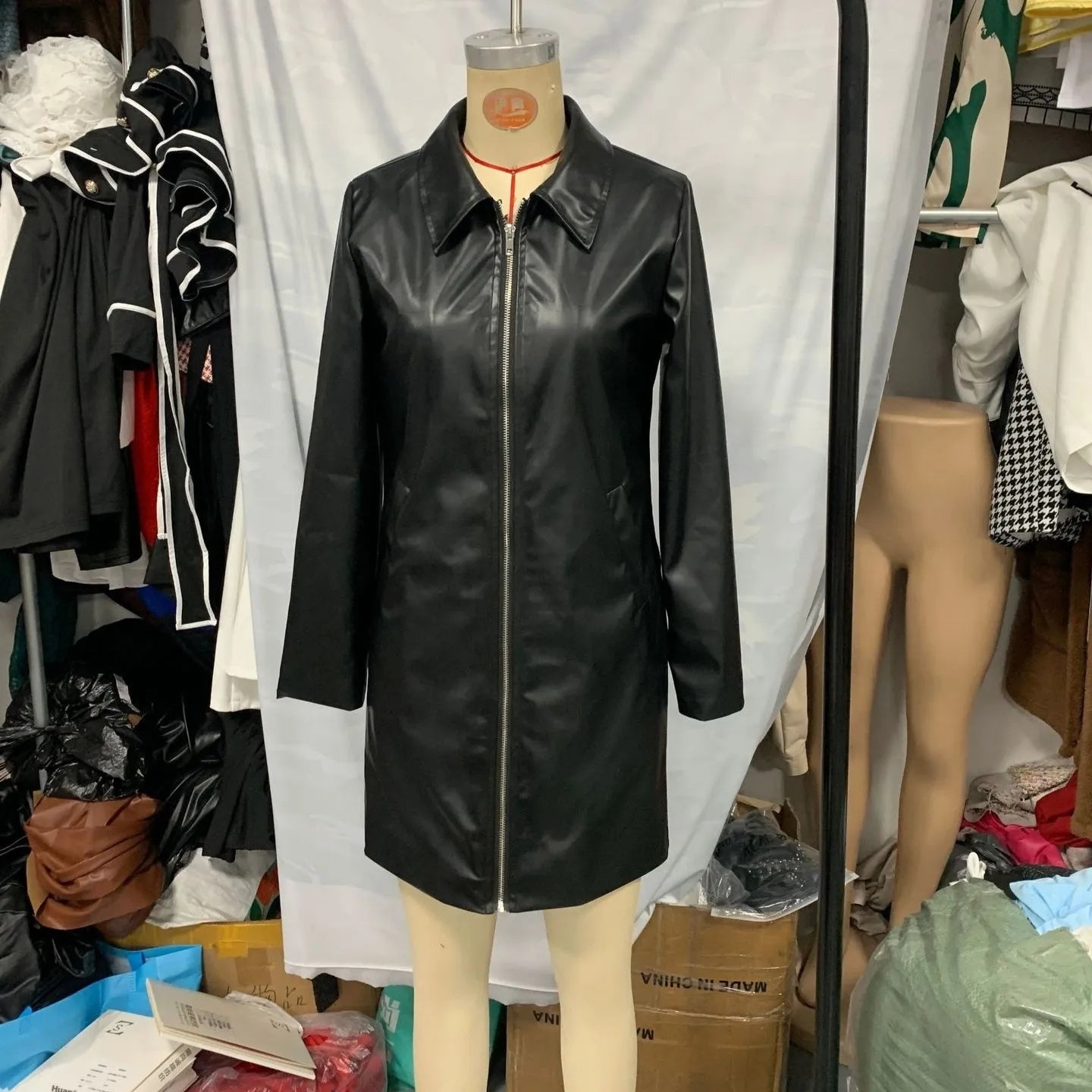 Women's black polyester leather jacket with medium length cut and long sleeves