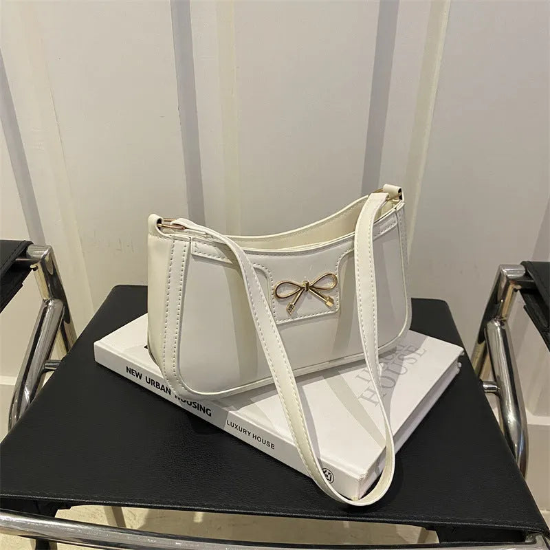 Western style baguette shoulder bag in six colours with 24x14x5cm dimensions and single strap