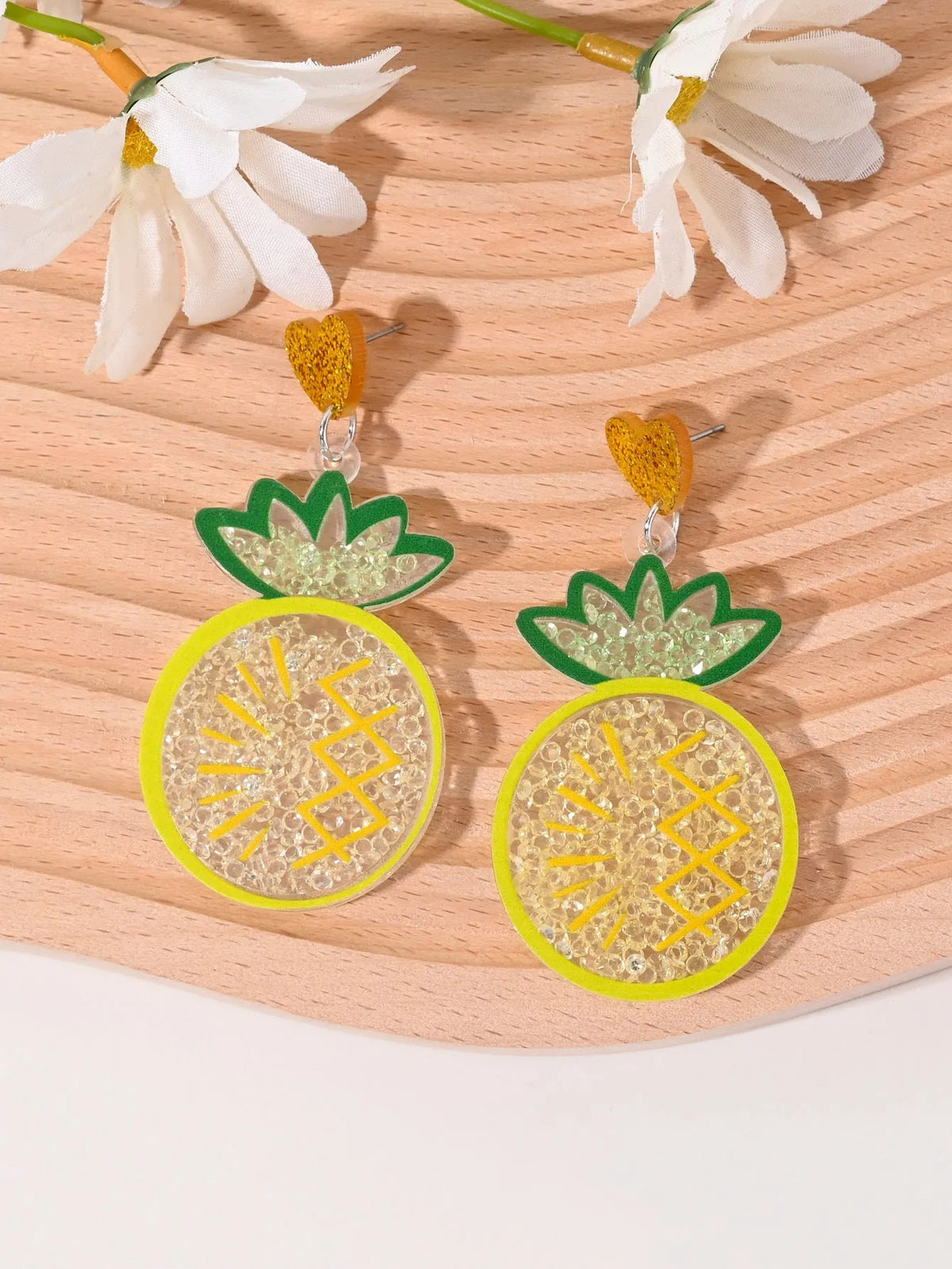 Acrylic drop earrings shaped like a strawberry, cherry, watermelon, pineapple, cake, ice cream, and coconut tree on a white background.