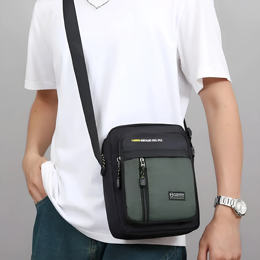 Men's casual nylon crossbody messenger bag showing sewing thread detail, available in black, blue, gray, or green.
