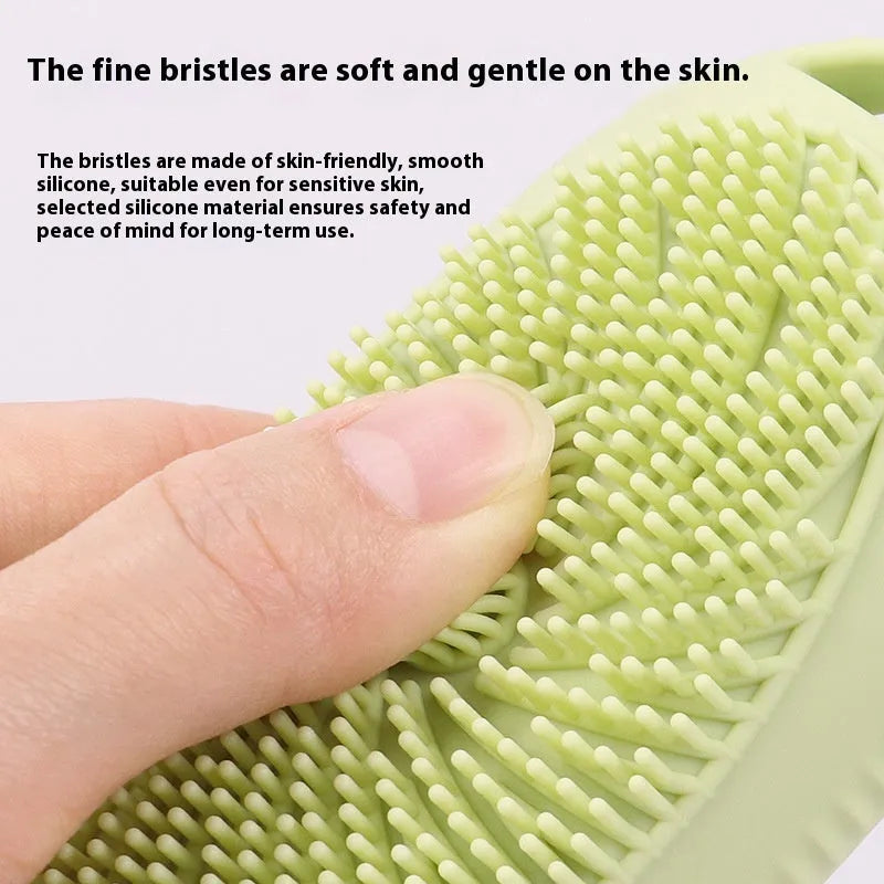 Silicone bath brush storage bottle in various colours on a bathroom shelf