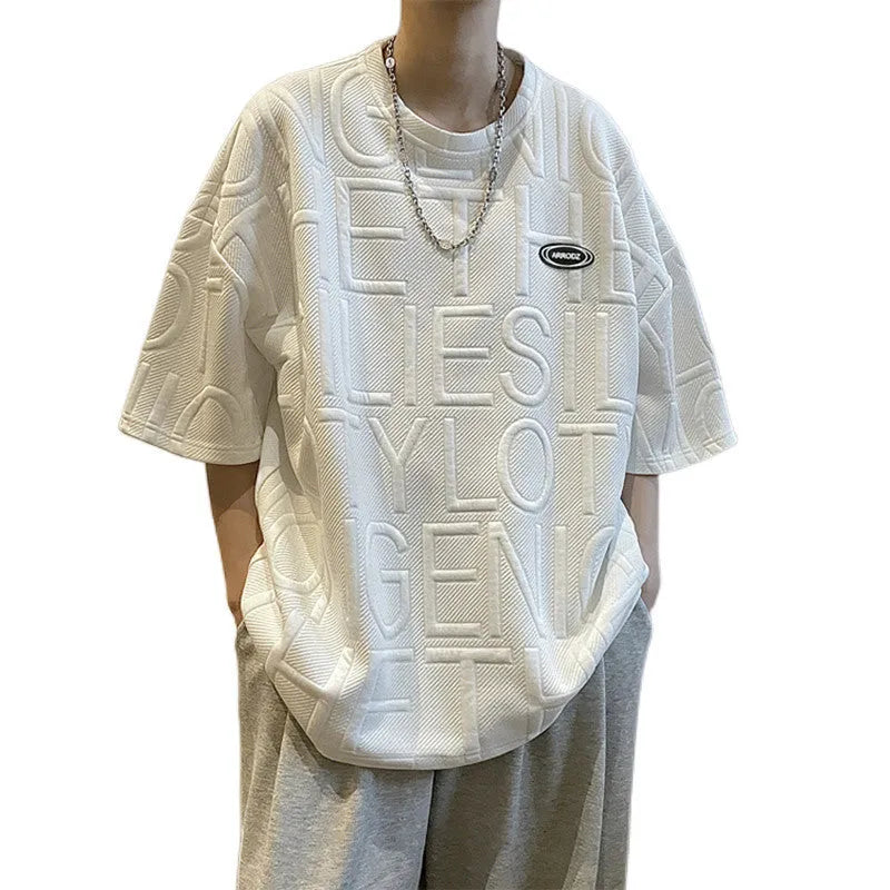 Men's grey loose fit short sleeve t-shirt with a raised white retro letter pattern on the chest.