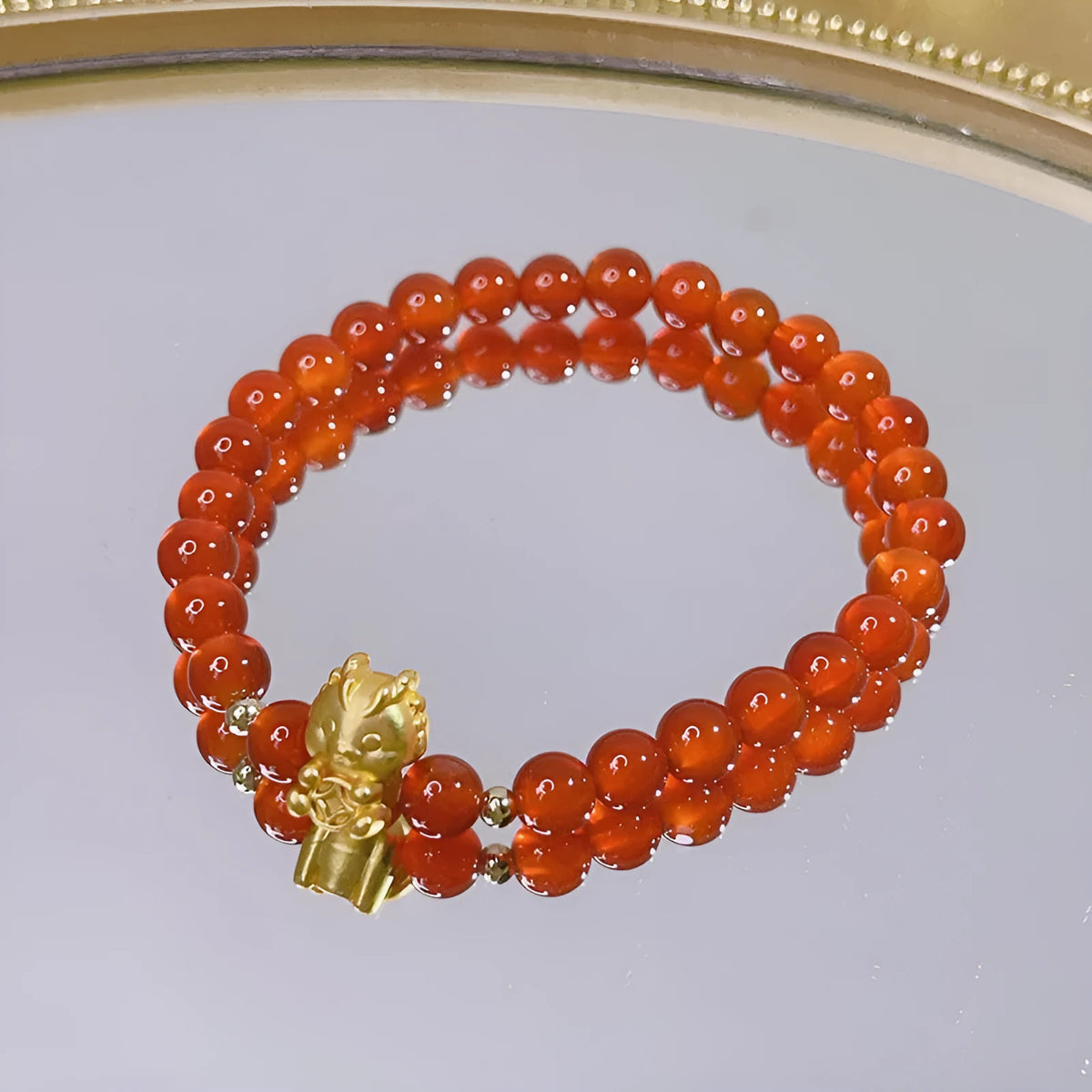 Red agate bracelet with Chinese lucky bag design and dragon motifs for women