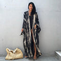 A printed, loose-fitting cotton beach cover-up blouse on a hanger, shown in a rust red colour from the DN0712 series.