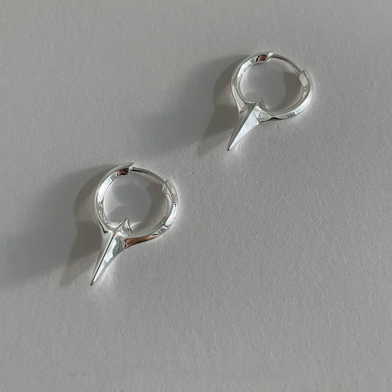 Platinum electroplated geometric star-shaped clip-on earrings for women.