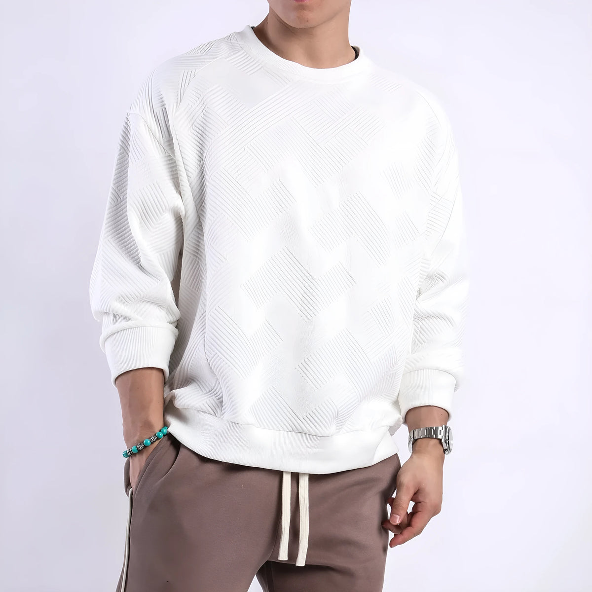 Men's loose fit twill Jacquard pullover sweater in army green, shown on a model.
