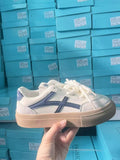 Brown and blue low-top casual lace-up shoes with a patent leather-look finish and flat rubber sole.