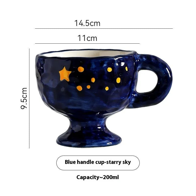 Hand-pinched irregular shaped solid colour ceramic mug on a table, showing its unique form and modern simplicity design.