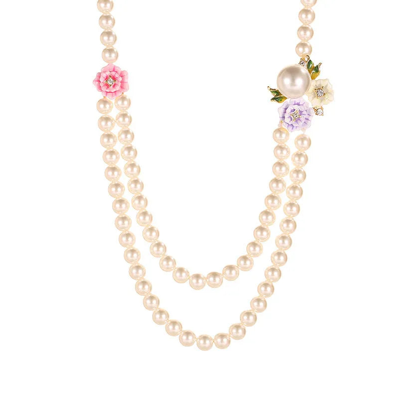 Enamel glaze diamond three-colour rose double-layer pearl necklace for women on display