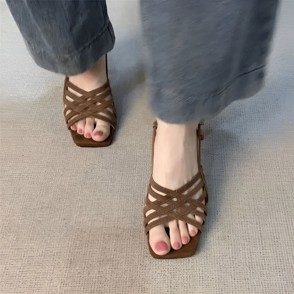Retro soft leather women's high heel sandals with thin cross straps and an ankle buckle in light brown.