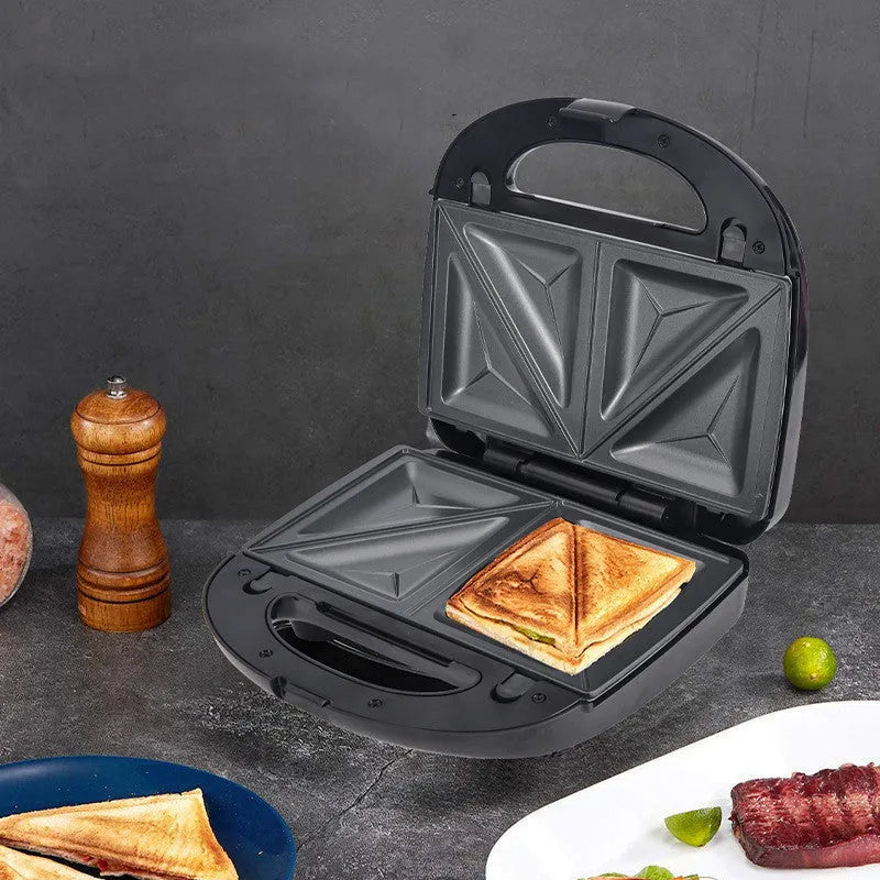Black double-sided electric sandwich pan with stainless steel lid and six non-stick pans.