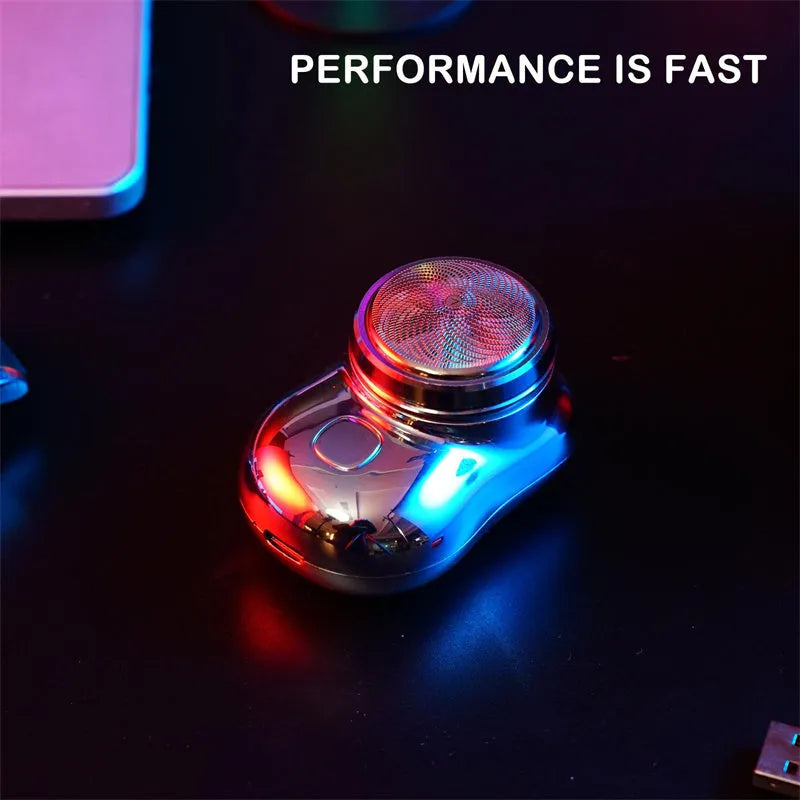 Mini portable USB electric shaver in silver with rotary head, aluminium body, and IPX7 wet and dry use