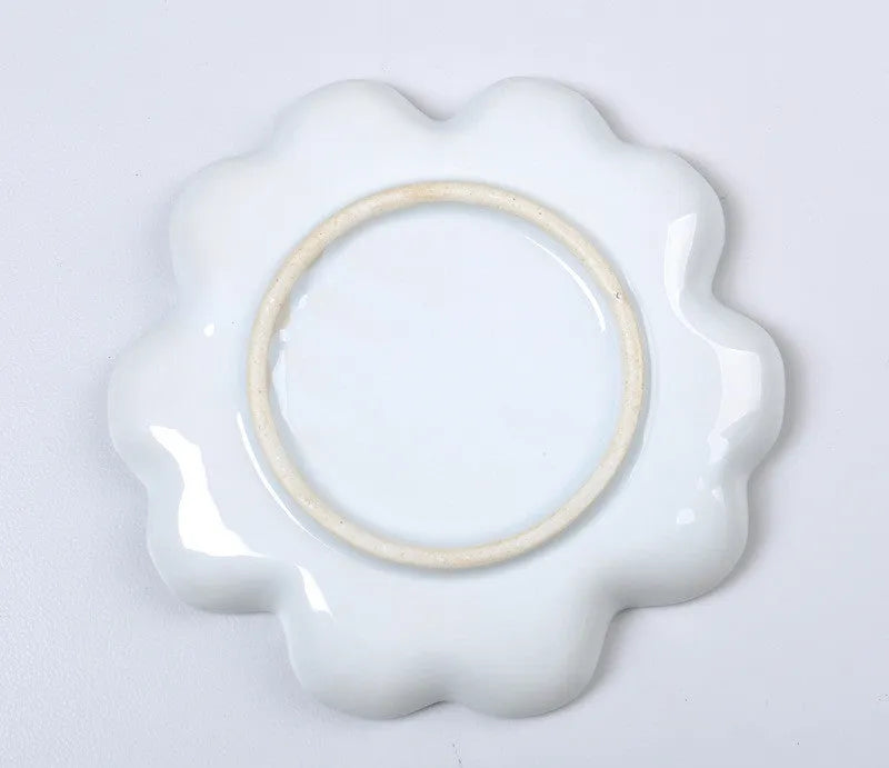White ceramic plum blossom shaped artist palette for oil, watercolour and acrylic painting