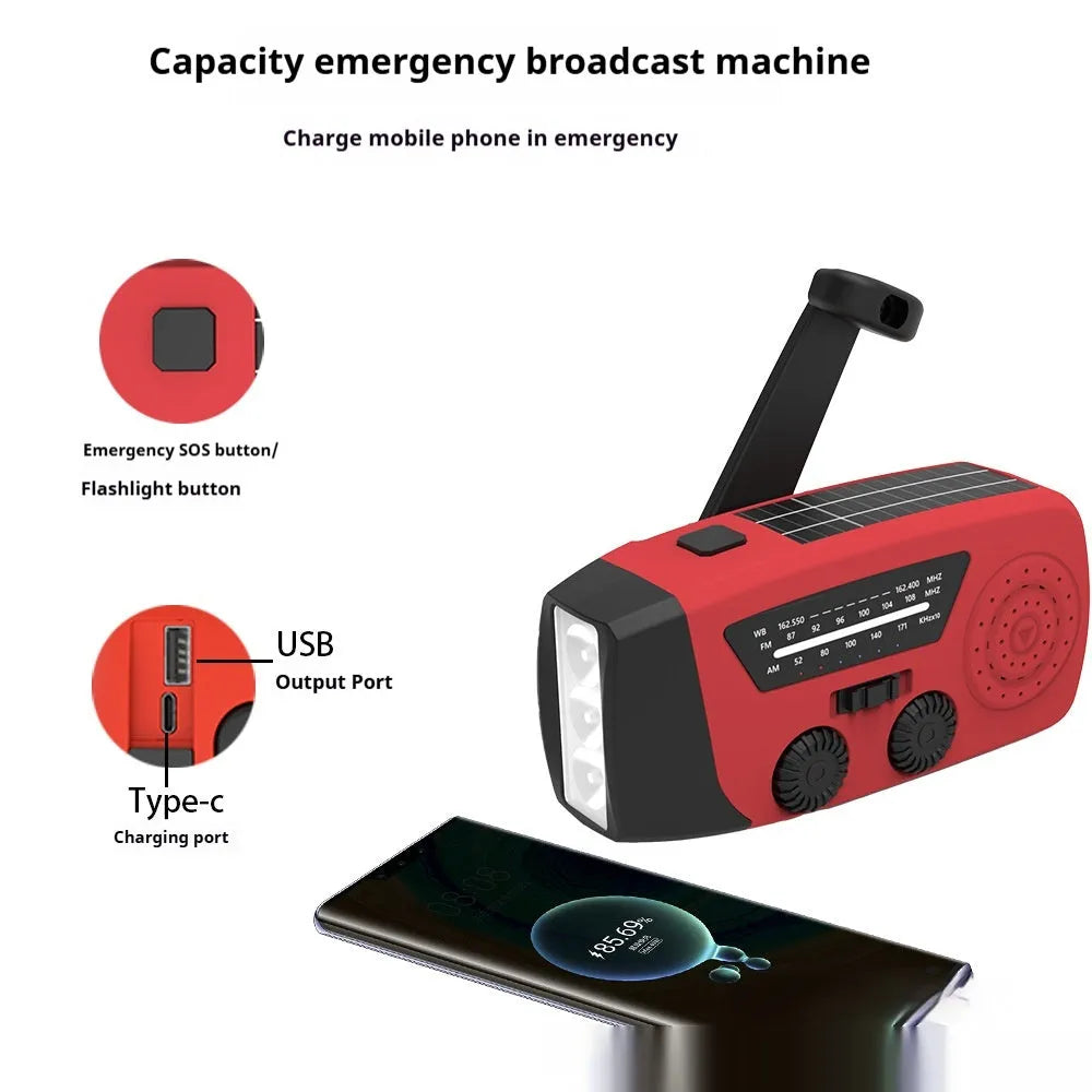 Red rechargeable emergency hand radio with built-in torch showing compact dimensions and wrist strap