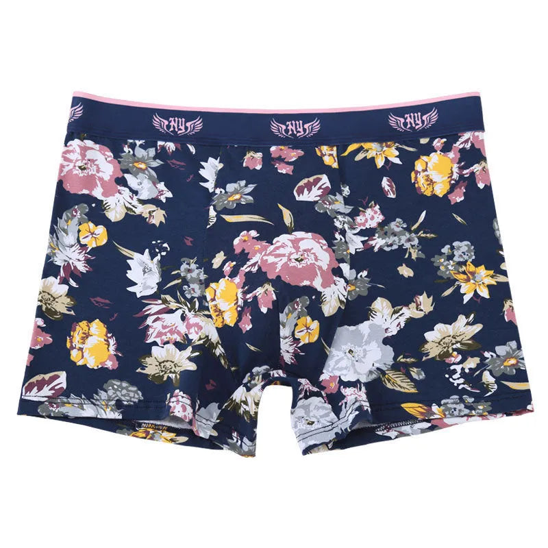 Men's cotton boxer shorts in a floral print, showing the mid-waist fit and U-shaped design.