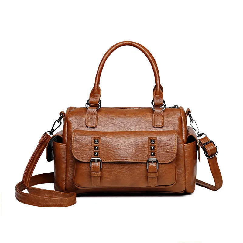 Vintage style large capacity square messenger bag in PU leather with contrast stitching.