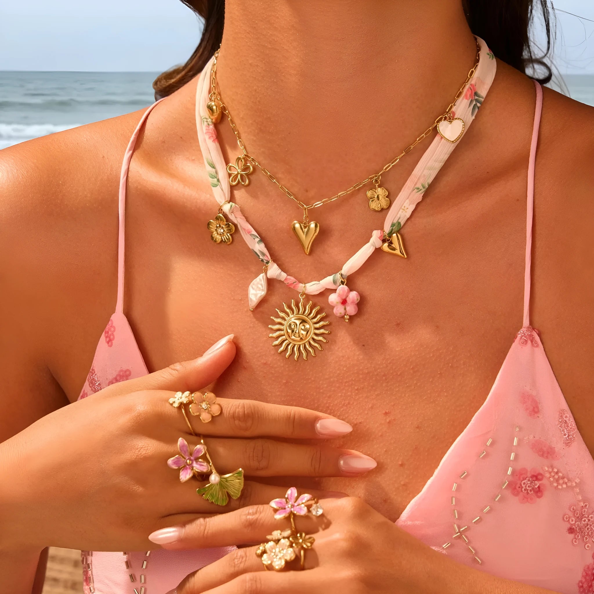 Stainless steel women's necklace with sun pendant on adjustable chain