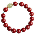 Purple gold sand cinnabar and Hetian jade beaded bracelet with geometric ellipse shapes on a wrist.