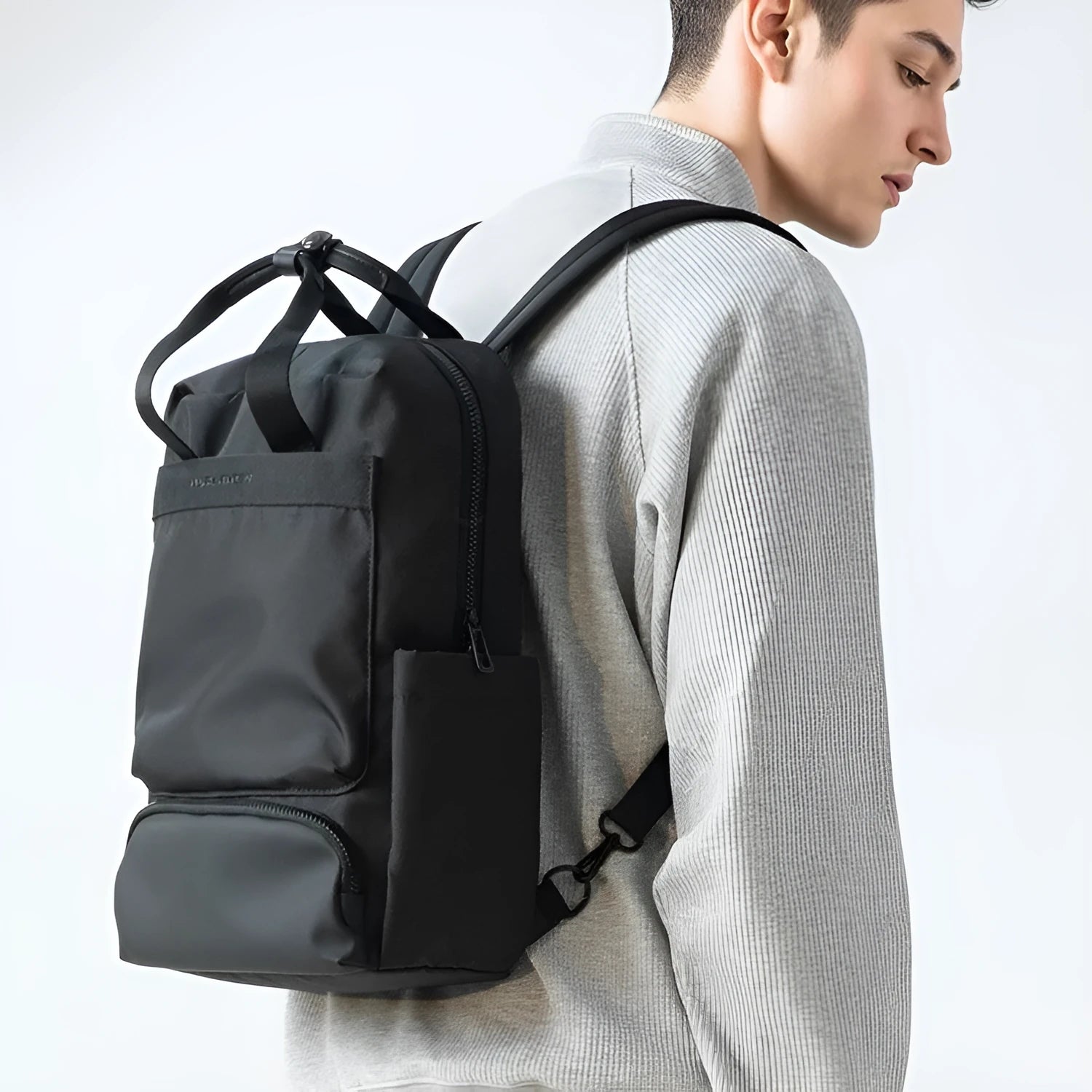 Black Oxford cloth computer backpack showing main compartment and 20-35 litre capacity.